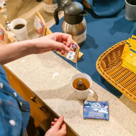 A person making a mug of one of the Smith teas.